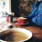 A relaxing morning enjoying coffee in a cozy café setting. Perfect for breakfast moments.
